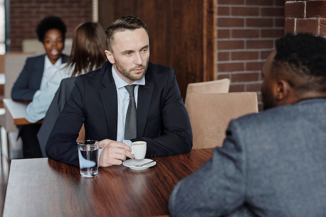 two people talking at a table